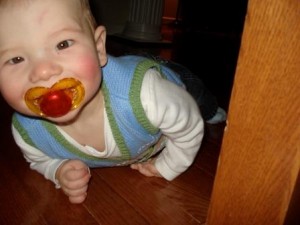 Baby with pacifier in mouth